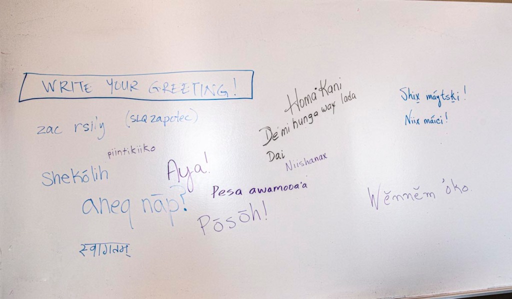 A number of greetings wrote on a whiteboard in over 10 Native American languages 